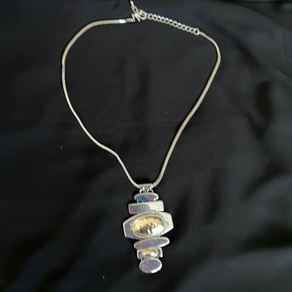 Silver tone and goldtone necklace with pendant